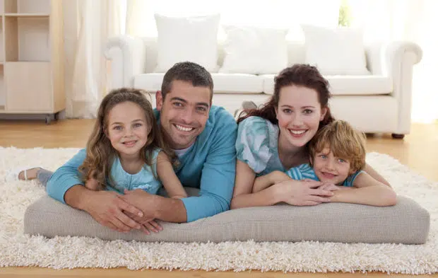 Family On Floor In Temporary Living Room